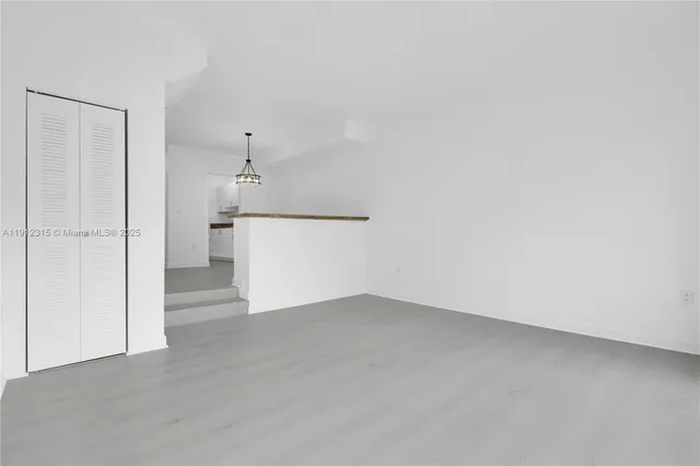 a view of a kitchen with a dishwasher and a refrigerator