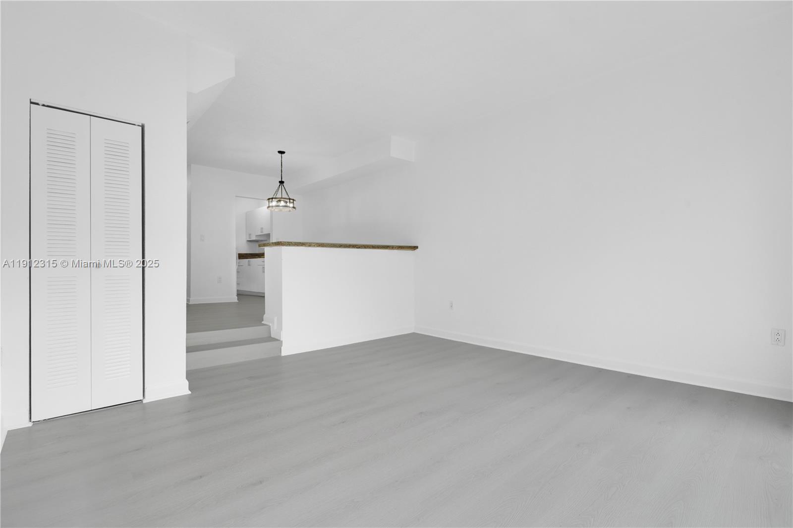 10900 Southwest 104th Street, Unit 121 Miami, FL 33176 - Photo 3 of 34 a view of a kitchen with a dishwasher and a refrigerator