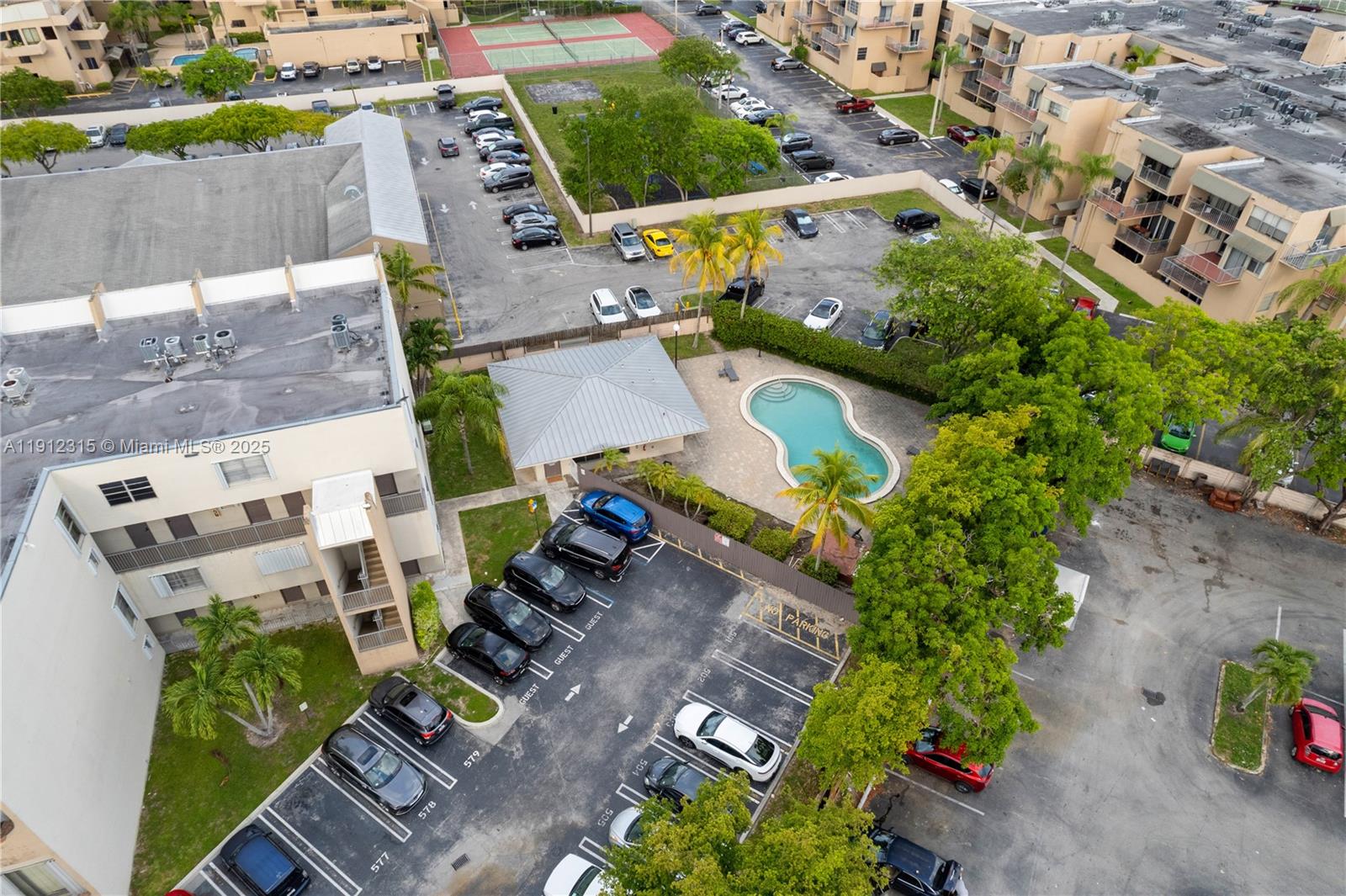 10900 Southwest 104th Street, Unit 121 Miami, FL 33176 - Photo 33 of 34 an aerial view of multiple houses with yard