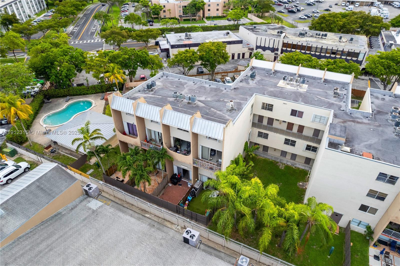 10900 Southwest 104th Street, Unit 121 Miami, FL 33176 - Photo 34 of 34 an aerial view of multiple houses with a yard