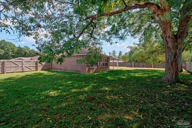 a backyard of a house with a garage