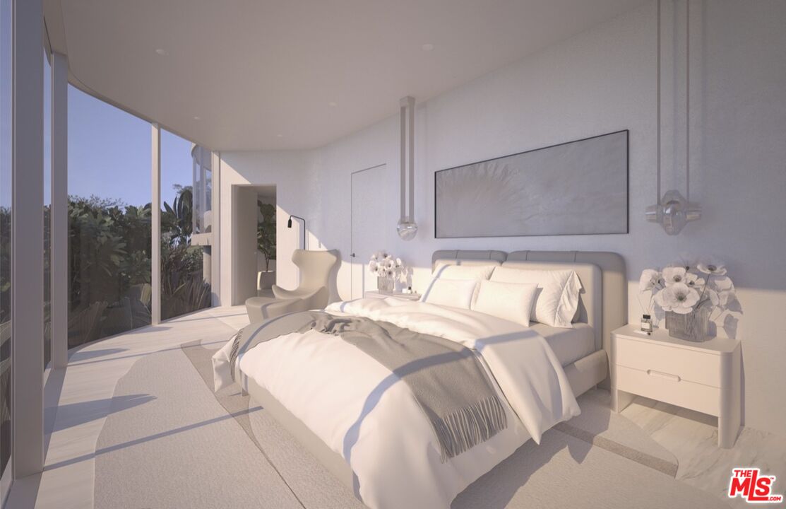 1 Eldermoor Drive Malibu, CA 90265 - Photo 20 of 23 a bedroom with a large bed and a chandelier