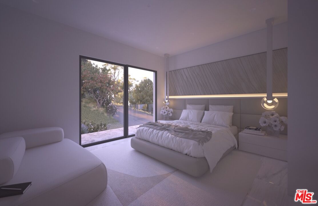 1 Eldermoor Drive Malibu, CA 90265 - Photo 21 of 23 a spacious bedroom with a bed and a large window