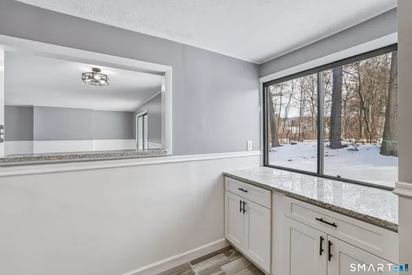 a view of a bathroom with a sink and mirror