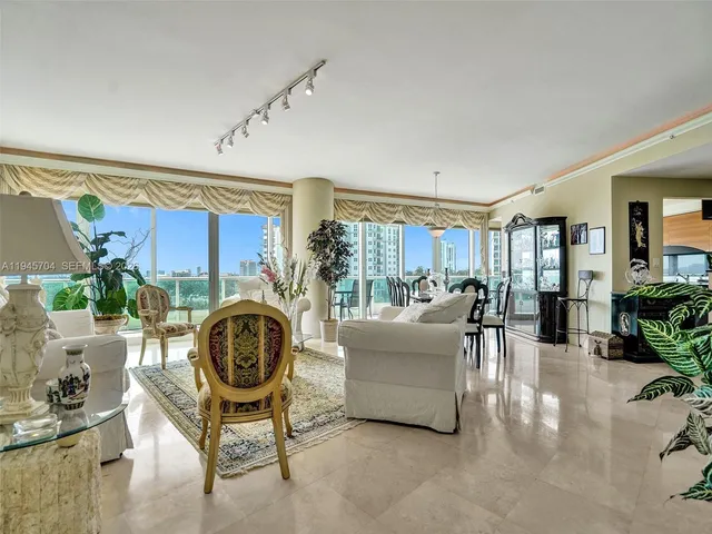 a living room with furniture and a clock