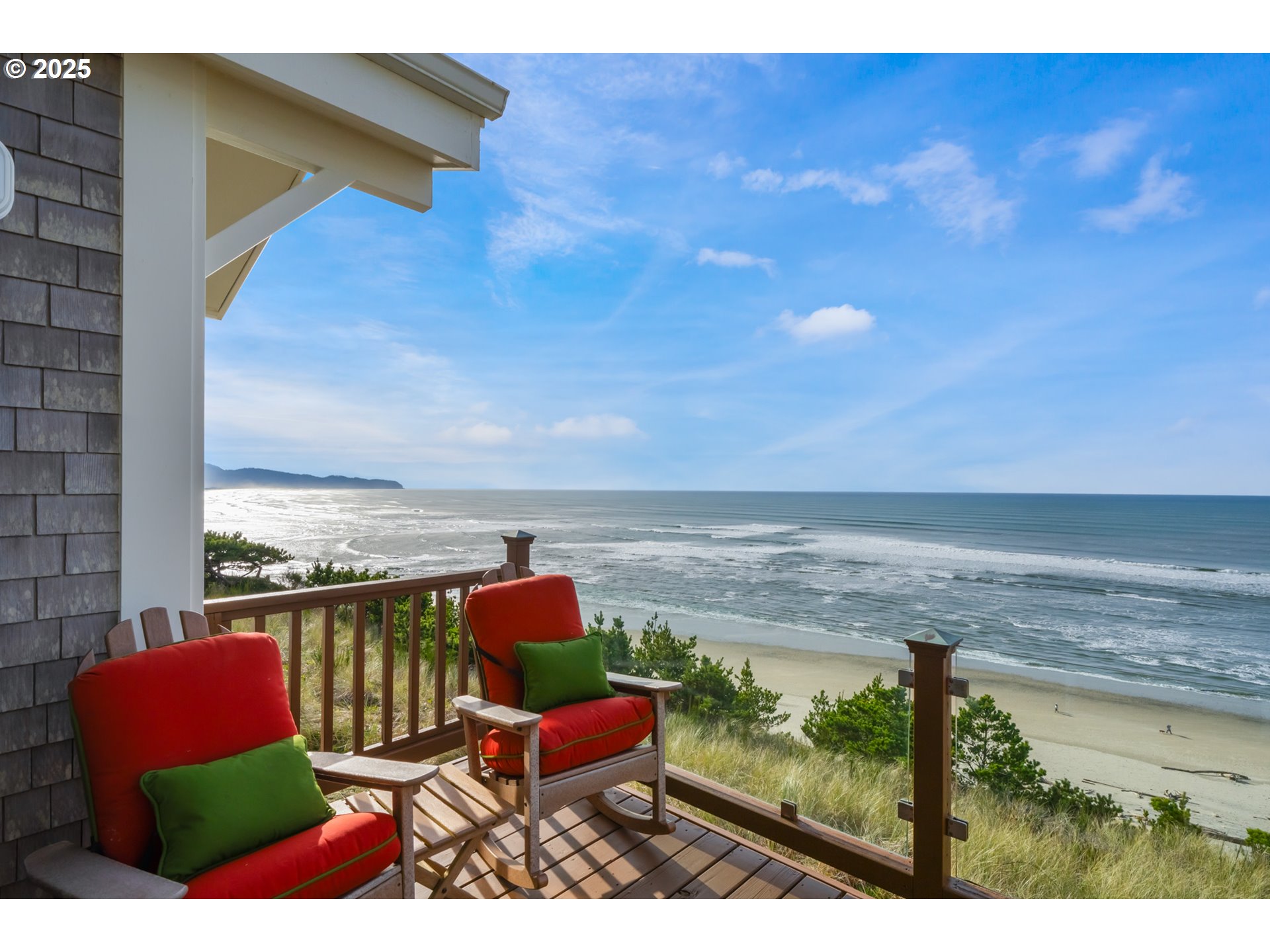 5235 Capes Loop Oceanside, OR 97141 - Photo 14 of 48 a balcony with chairs and city view