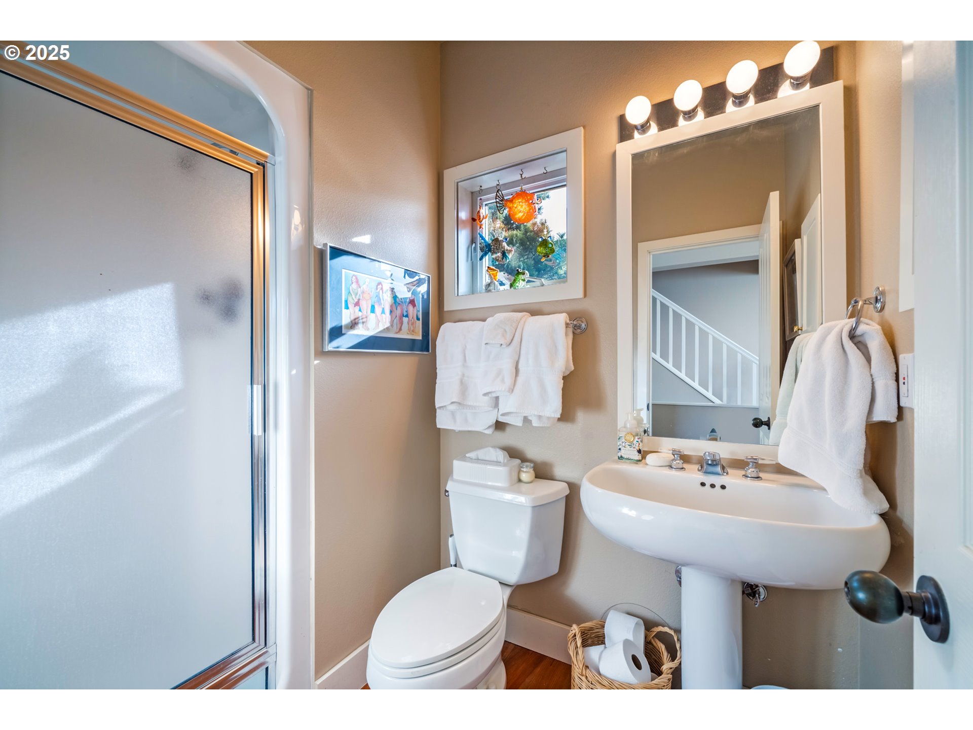 5235 Capes Loop Oceanside, OR 97141 - Photo 20 of 48 a bathroom with a sink toilet and a mirror