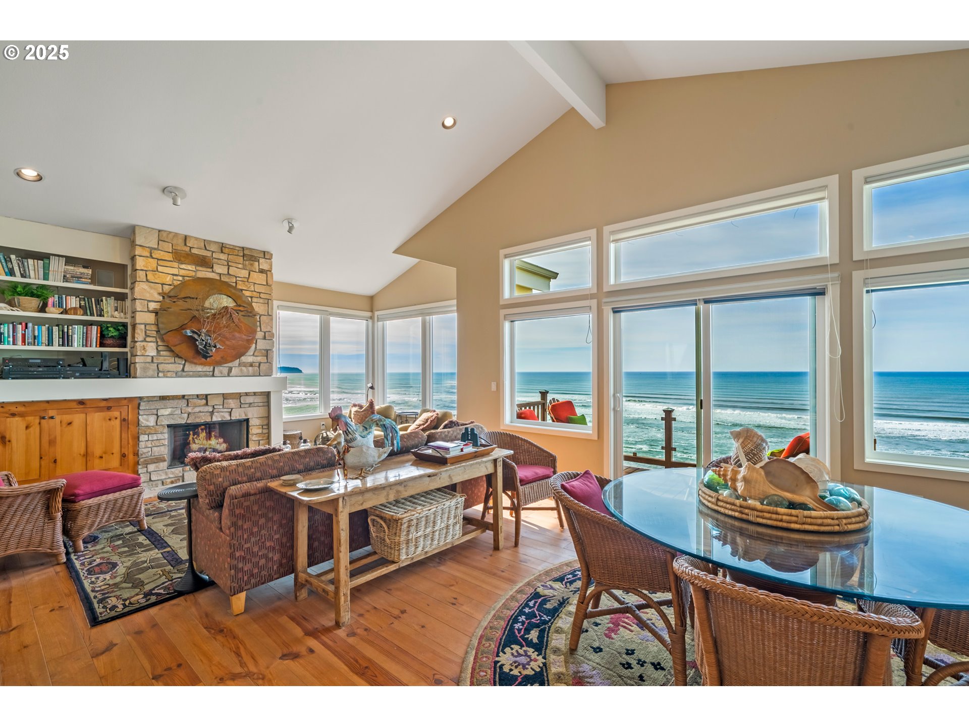 5235 Capes Loop Oceanside, OR 97141 - Photo 2 of 48 a living room with furniture and floor to ceiling windows