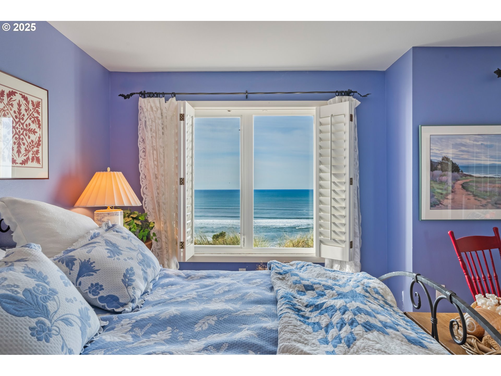 5235 Capes Loop Oceanside, OR 97141 - Photo 24 of 48 a bedroom with a bed and a window