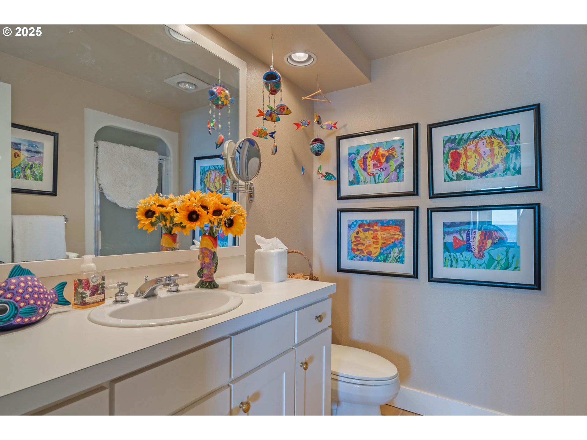5235 Capes Loop Oceanside, OR 97141 - Photo 29 of 48 a bathroom with a toilet a sink and a mirror