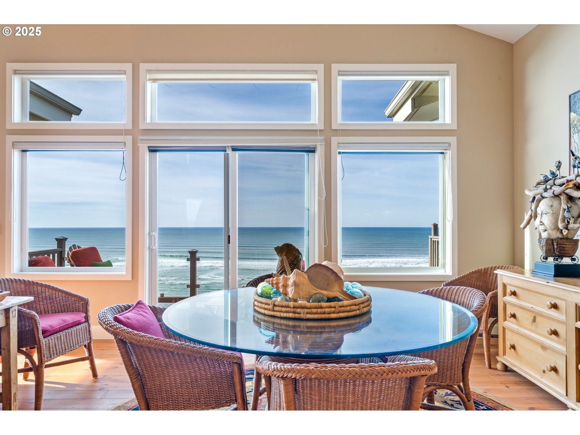 5235 Capes Loop Oceanside, OR 97141 - Photo 7 of 48 a view of a dining room with a table and chairs