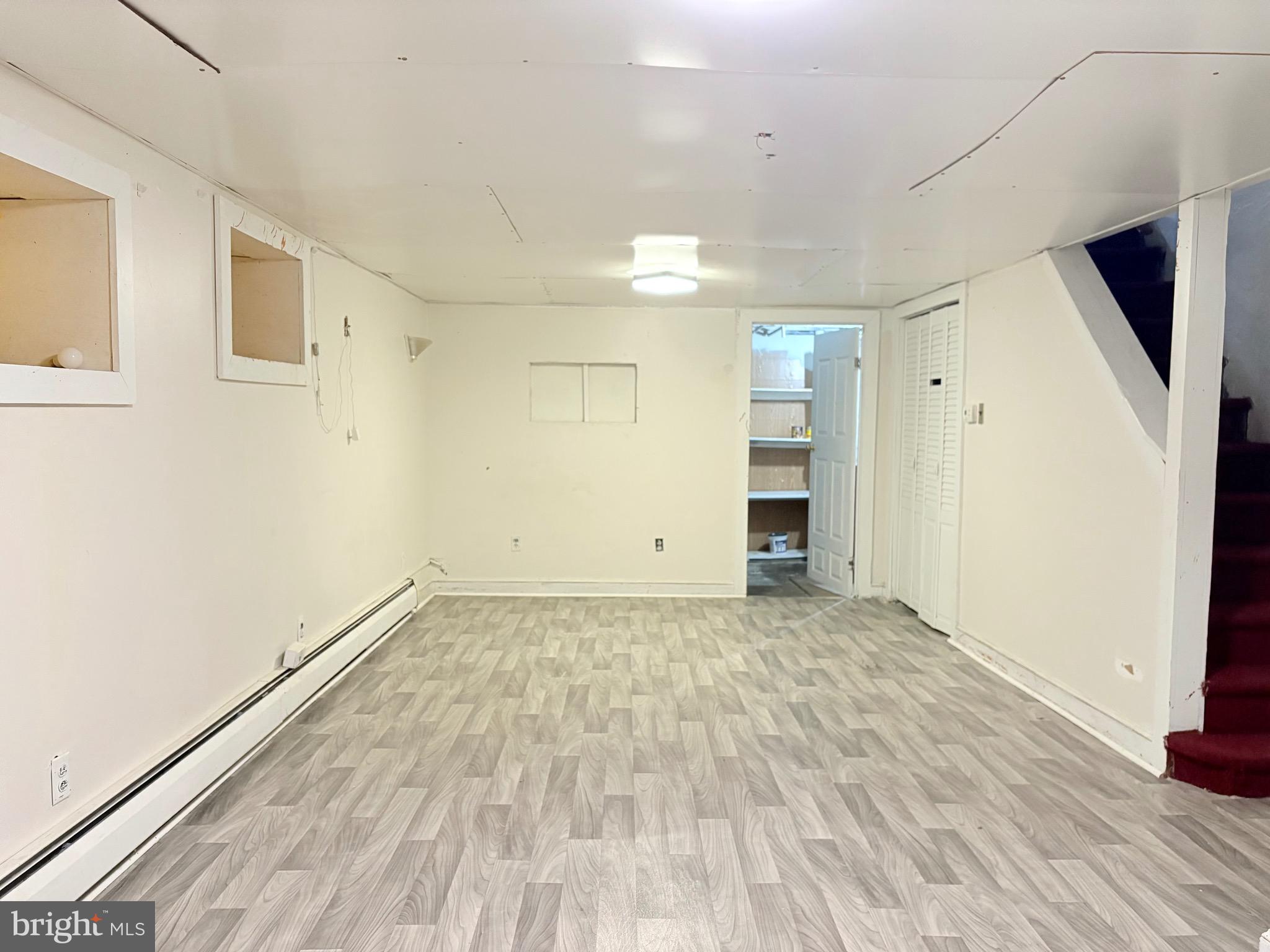 233 Barrington Road Upper Darby, PA 19082 - Photo 12 of 14 a view of an empty room with wooden floor and a window