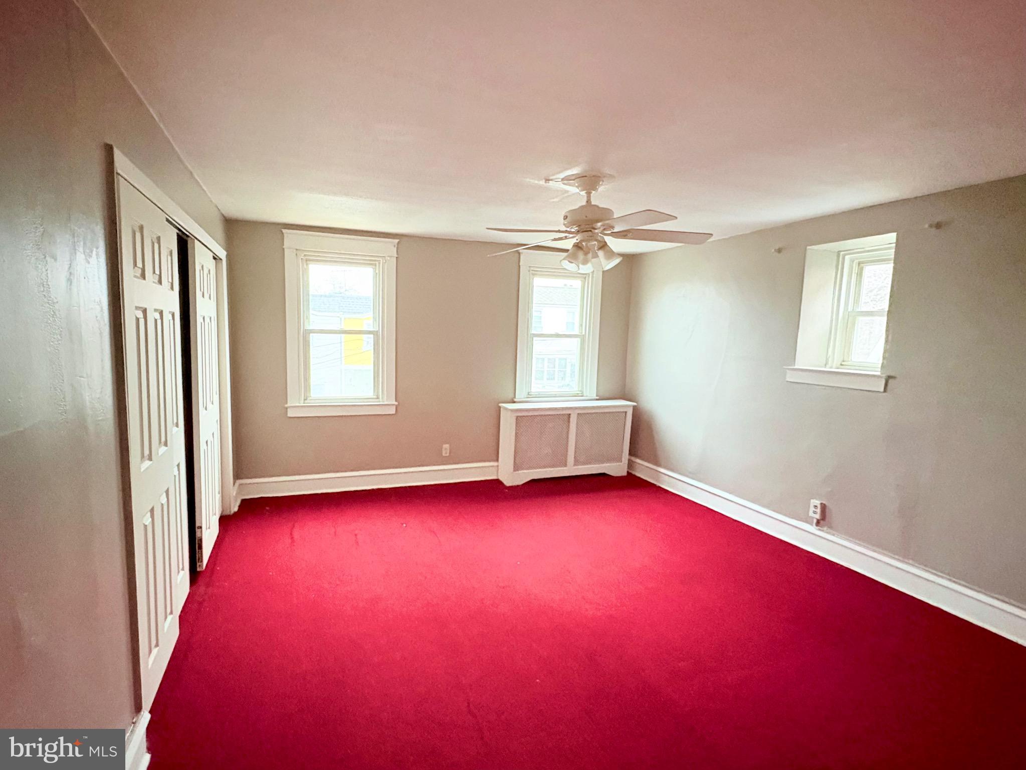233 Barrington Road Upper Darby, PA 19082 - Photo 4 of 14 an empty room with windows and closet
