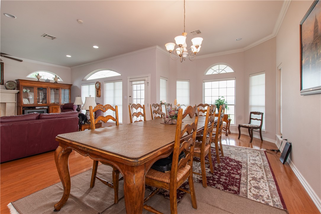 3521 FM 438 Loop Temple, TX 76501 - Photo 17 of 32 a view of a dining room with furniture and wooden floor