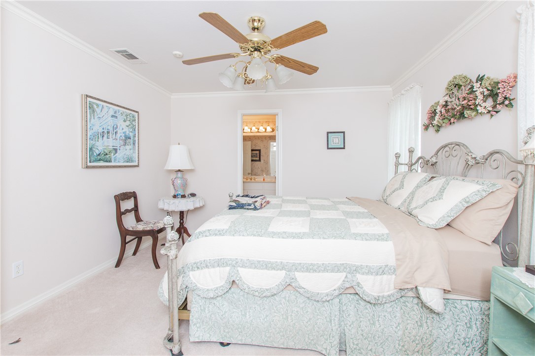 3521 FM 438 Loop Temple, TX 76501 - Photo 24 of 32 a bedroom with a bed and a chair with potted plant