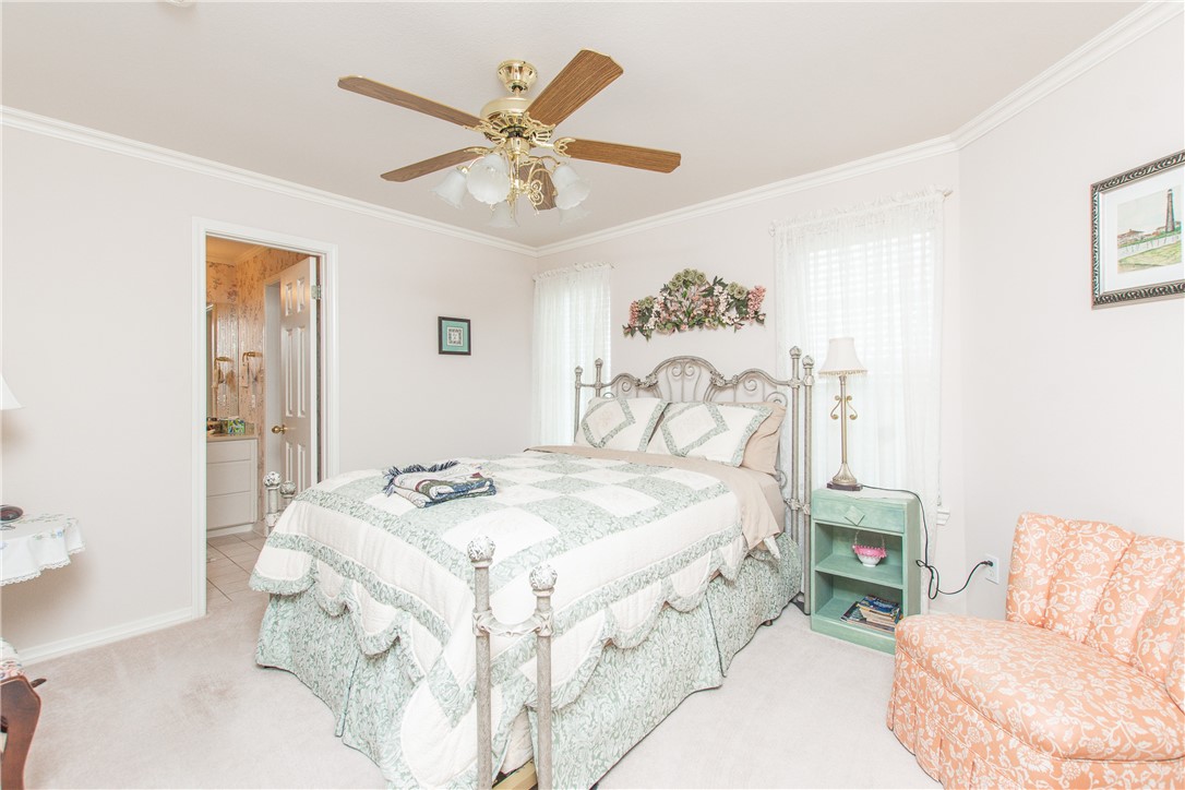 3521 FM 438 Loop Temple, TX 76501 - Photo 26 of 32 a bedroom with a bed and a chandelier