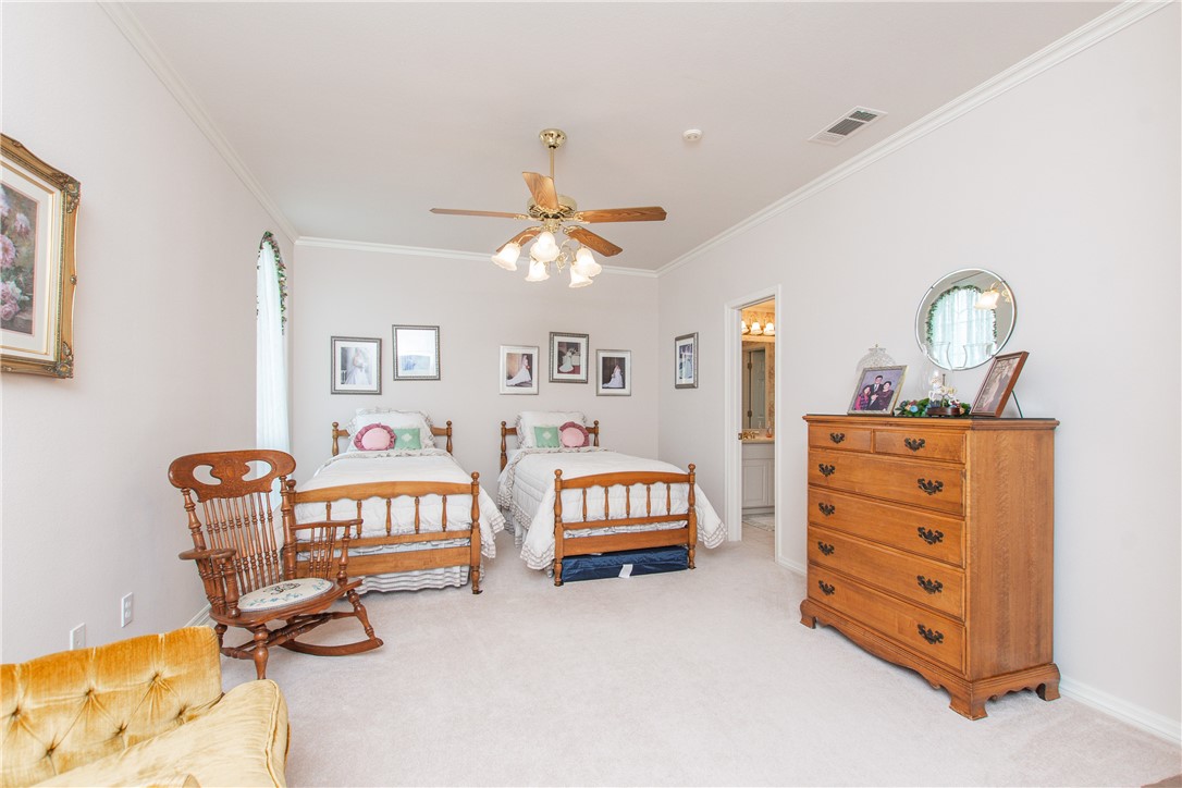 3521 FM 438 Loop Temple, TX 76501 - Photo 29 of 32 a bedroom with furniture and a chandelier