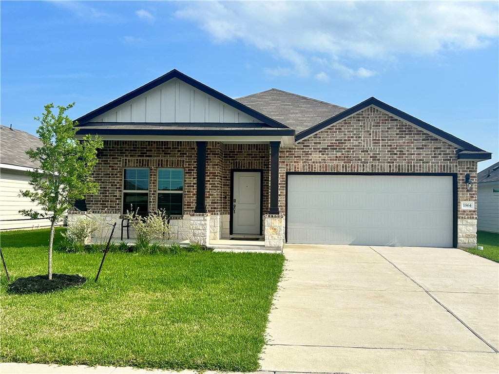 1864 Taggart Trail Bryan, TX 77807 - Photo 1 of 12 a front view of a house with a yard and porch
