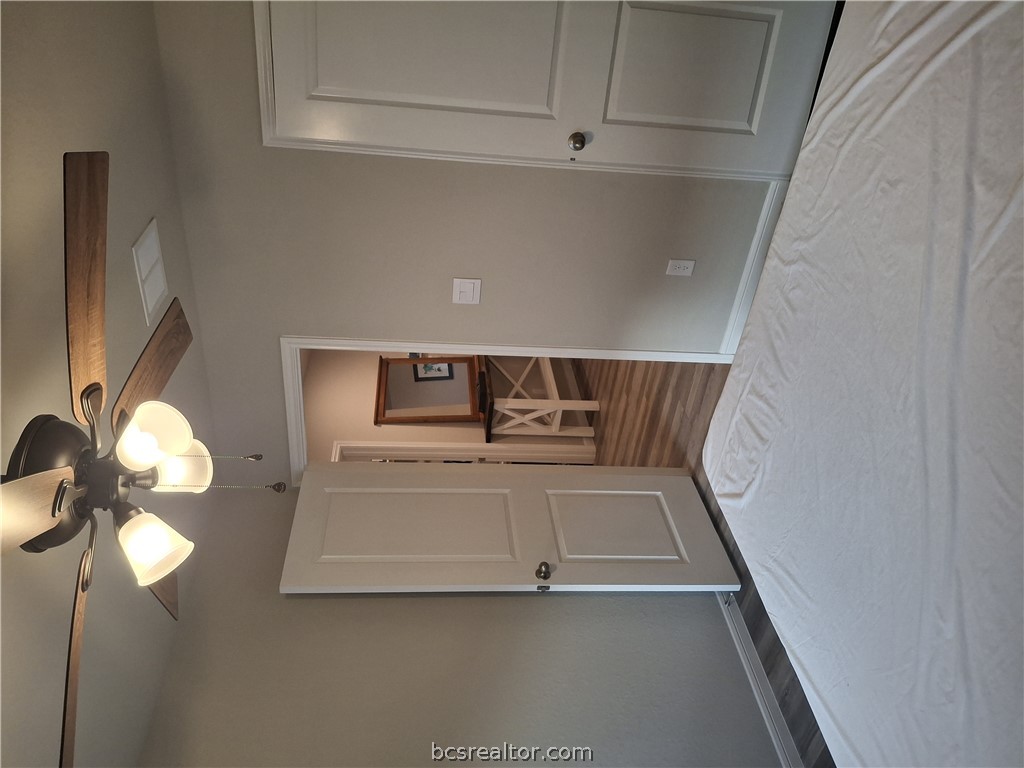 1864 Taggart Trail Bryan, TX 77807 - Photo 12 of 12 a view of a room with a ceiling fan and a hardwood floor