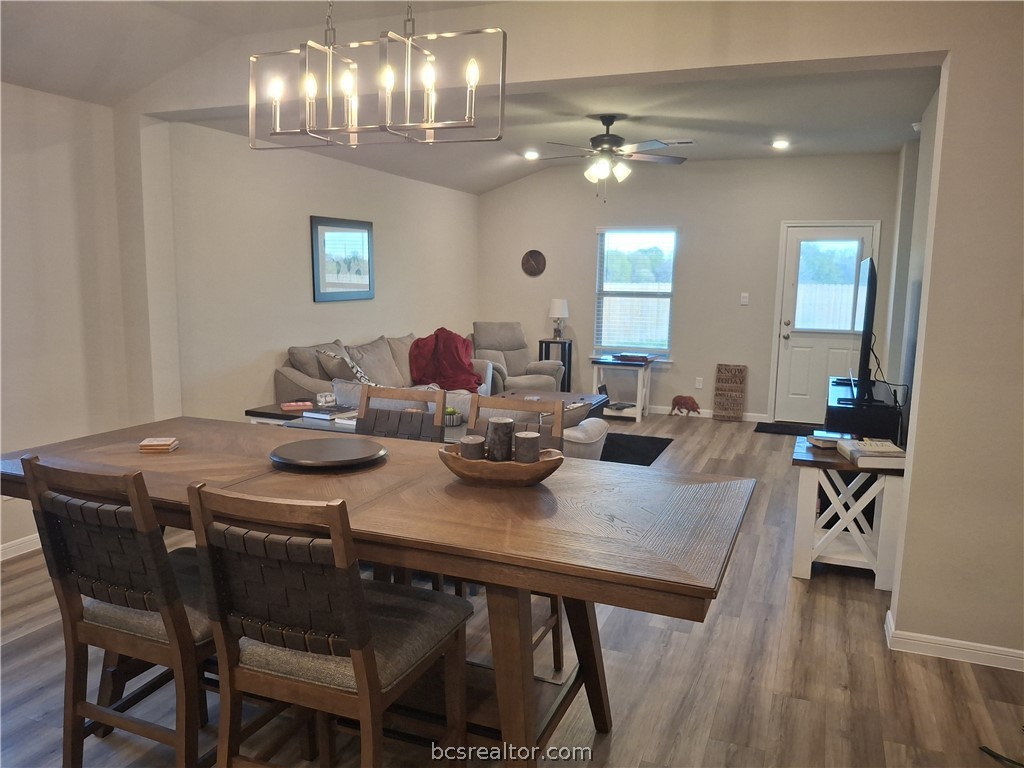 1864 Taggart Trail Bryan, TX 77807 - Photo 2 of 12 a view of a dining room with furniture and wooden floor