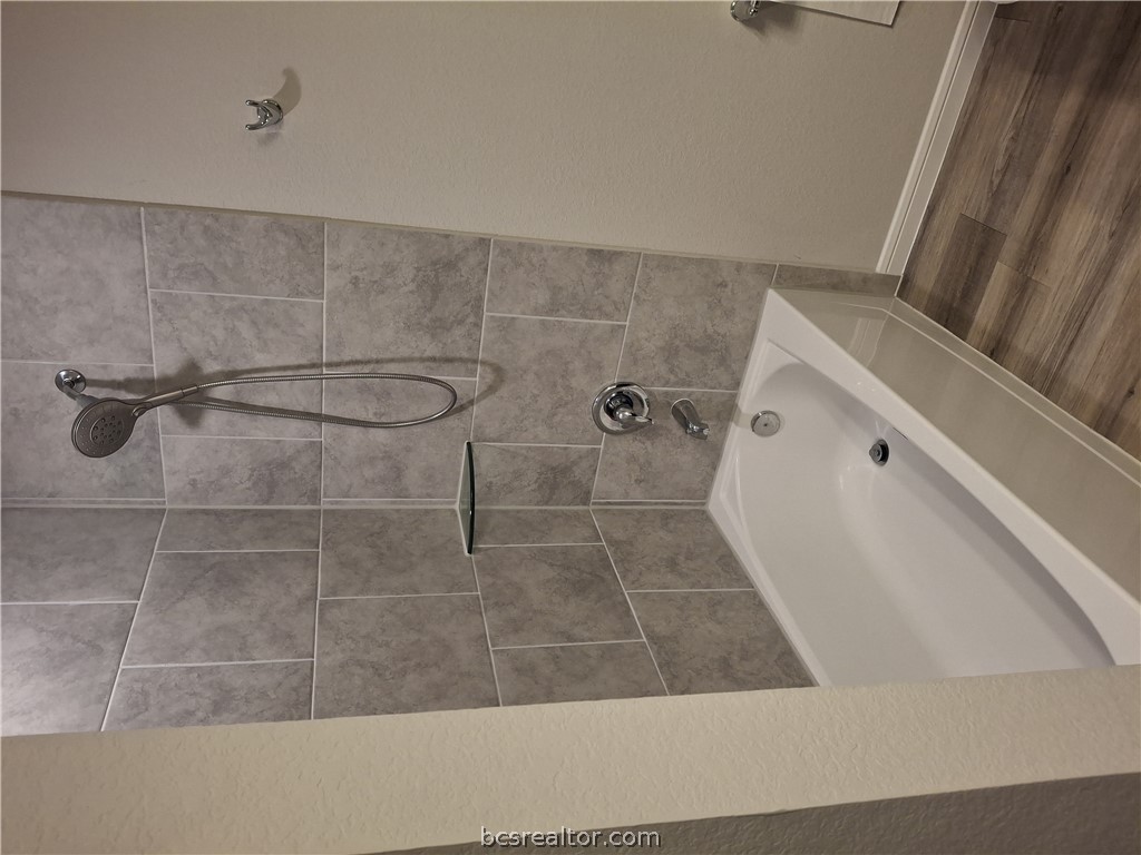 1864 Taggart Trail Bryan, TX 77807 - Photo 7 of 12 a bathroom with a bath tub and shower