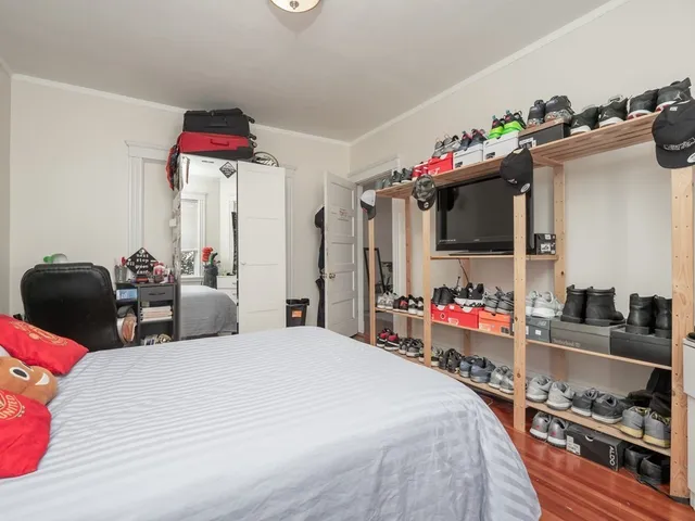 a very nice looking bedroom with a bed and a flat screen tv