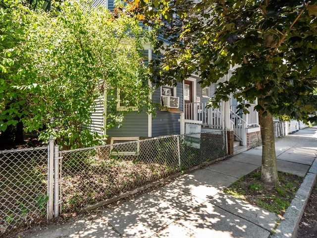 a backyard of a house with lots of tree