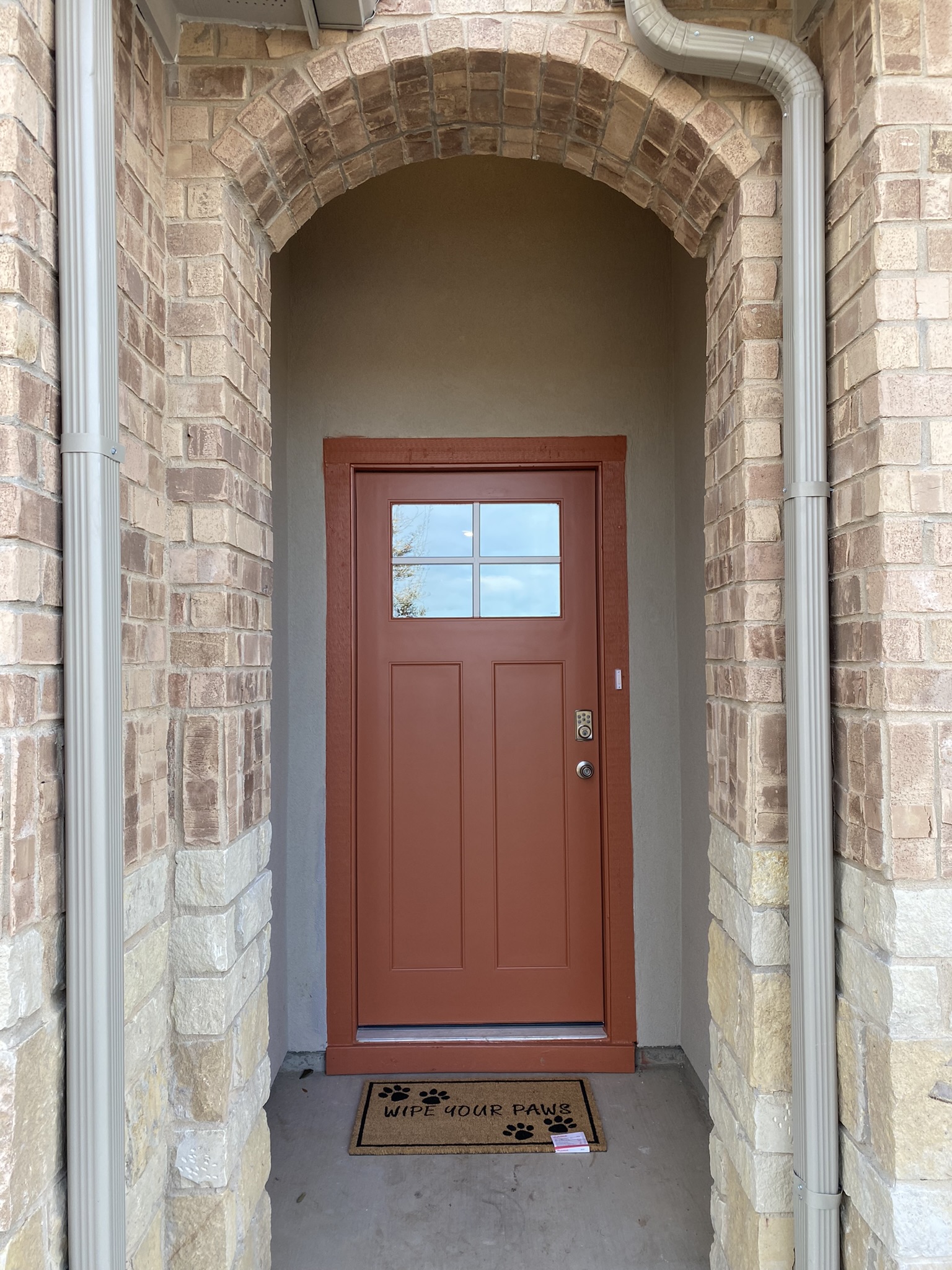 236 Sunniberg Loop Georgetown, TX 78626 - Photo 2 of 22 An arched brick entryway frames the recessed front door, creating a welcoming first impression.