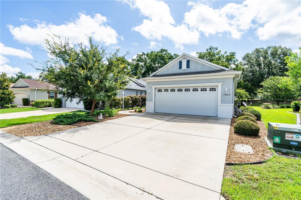 a view of swimming pool with a yard in front of it