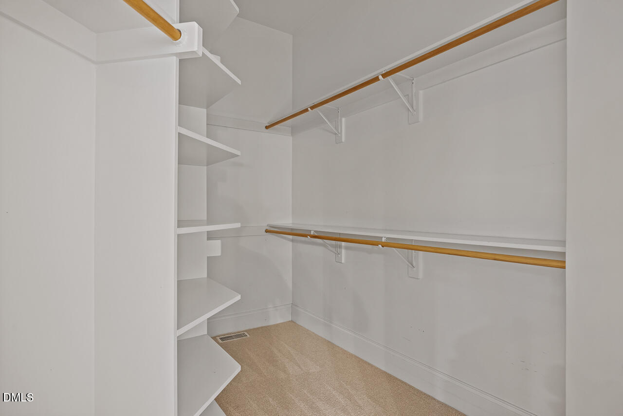 4004 Frontenac Court Apex, NC 27539 - Photo 31 of 61 a view of an empty walk in closet