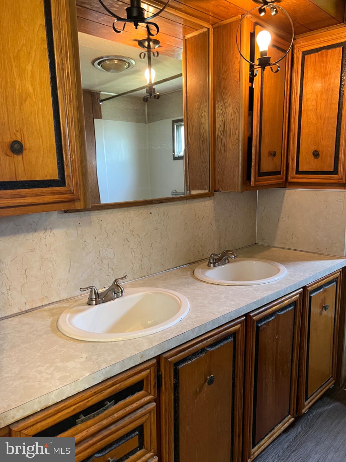 1302 Gibson Road, Unit 152 Bensalem, PA 19020 - Photo 13 of 18 a bathroom with a sink and a mirror
