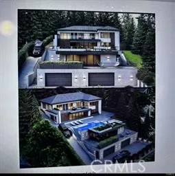 an aerial view of a house with balcony and large trees