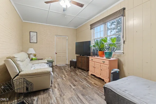 a view of a dining room with furniture and wooden floor