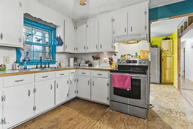 a bathroom with a sink a toilet and vanity