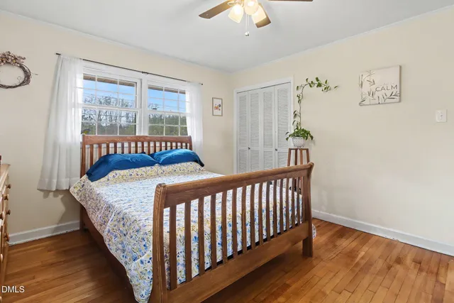 a view of backyard of house with green space