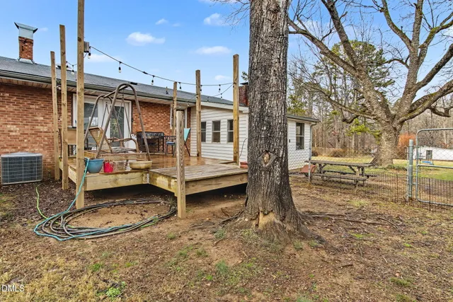 an aerial view of a house with outdoor space