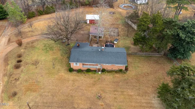 a view of a street with tall trees