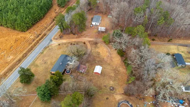 an aerial view of a house with a swimming pool