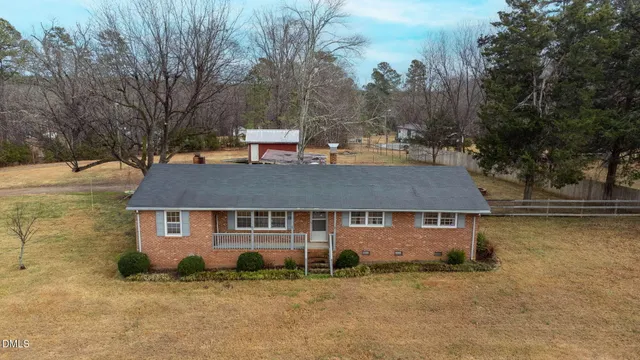 a bedroom with furniture and windows