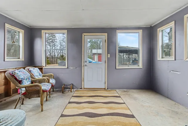 a living room with furniture and windows