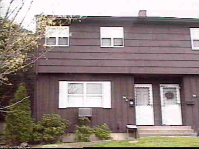 74 Ridge Road, Unit 2 Naugatuck, CT 06770 - Photo 1 of 1 a front view of a house with garden