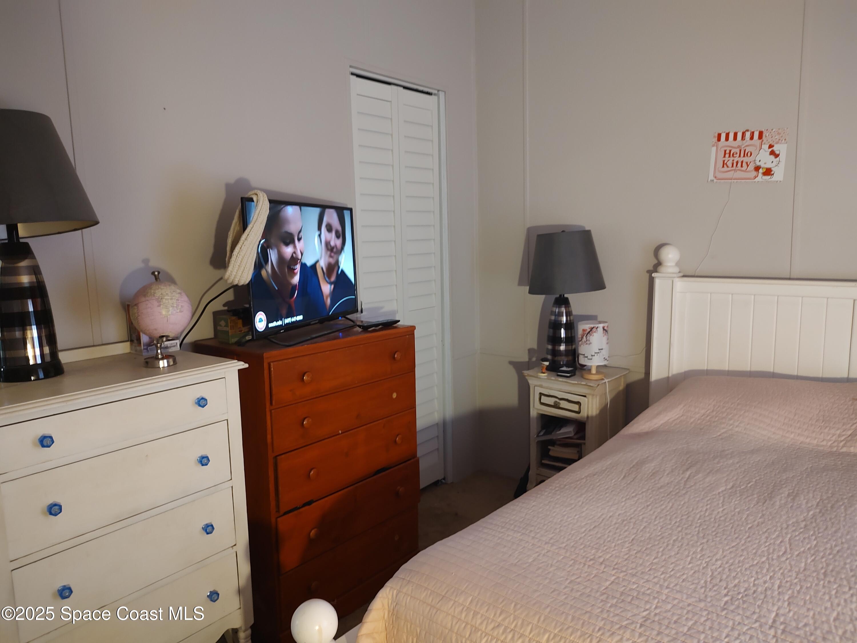 3314 Nab Street Mims, FL 32754 - Photo 22 of 27 a bedroom with a bed and furniture