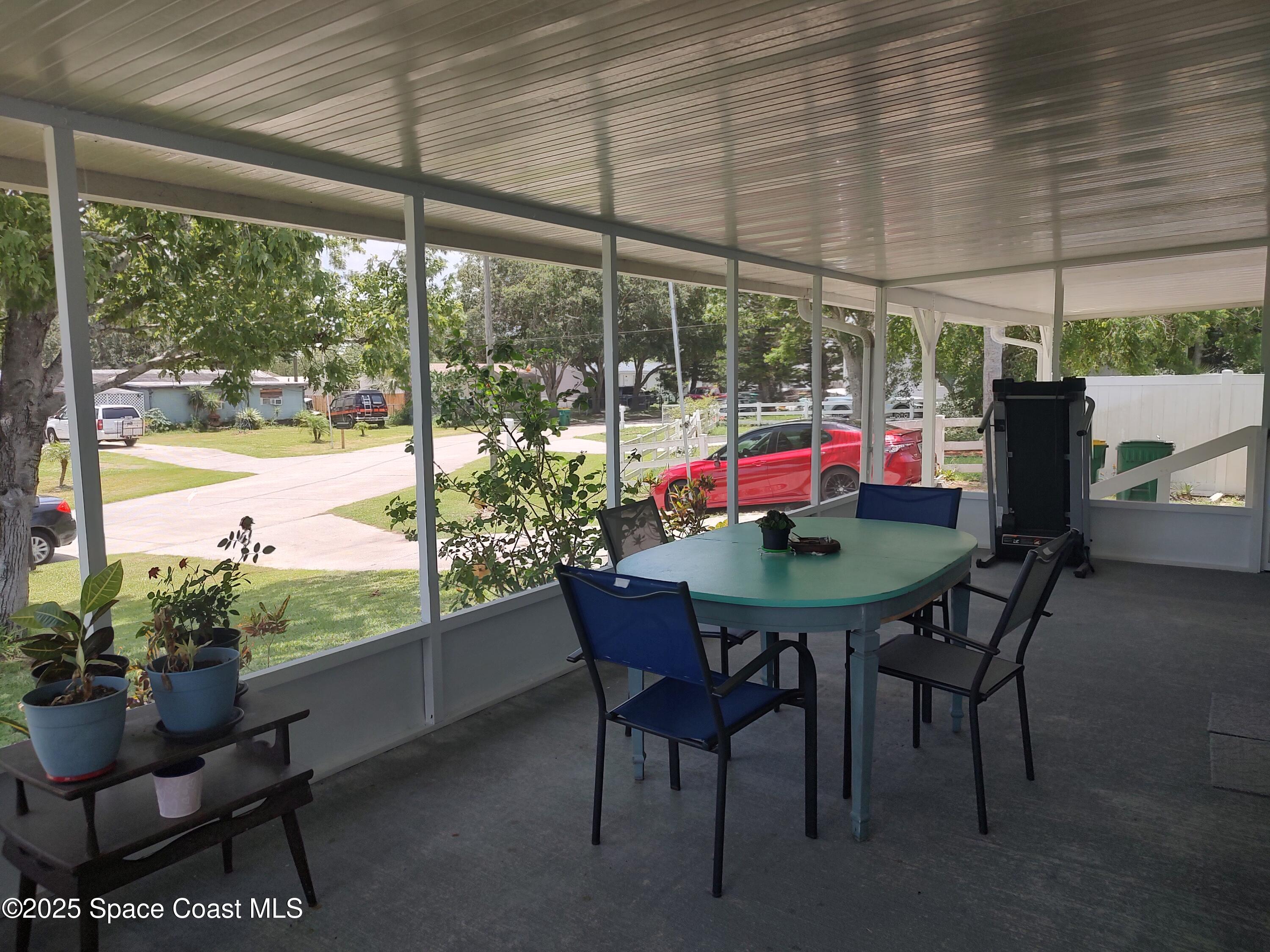 3314 Nab Street Mims, FL 32754 - Photo 6 of 27 a view of an outdoor dining space with furniture and garden view