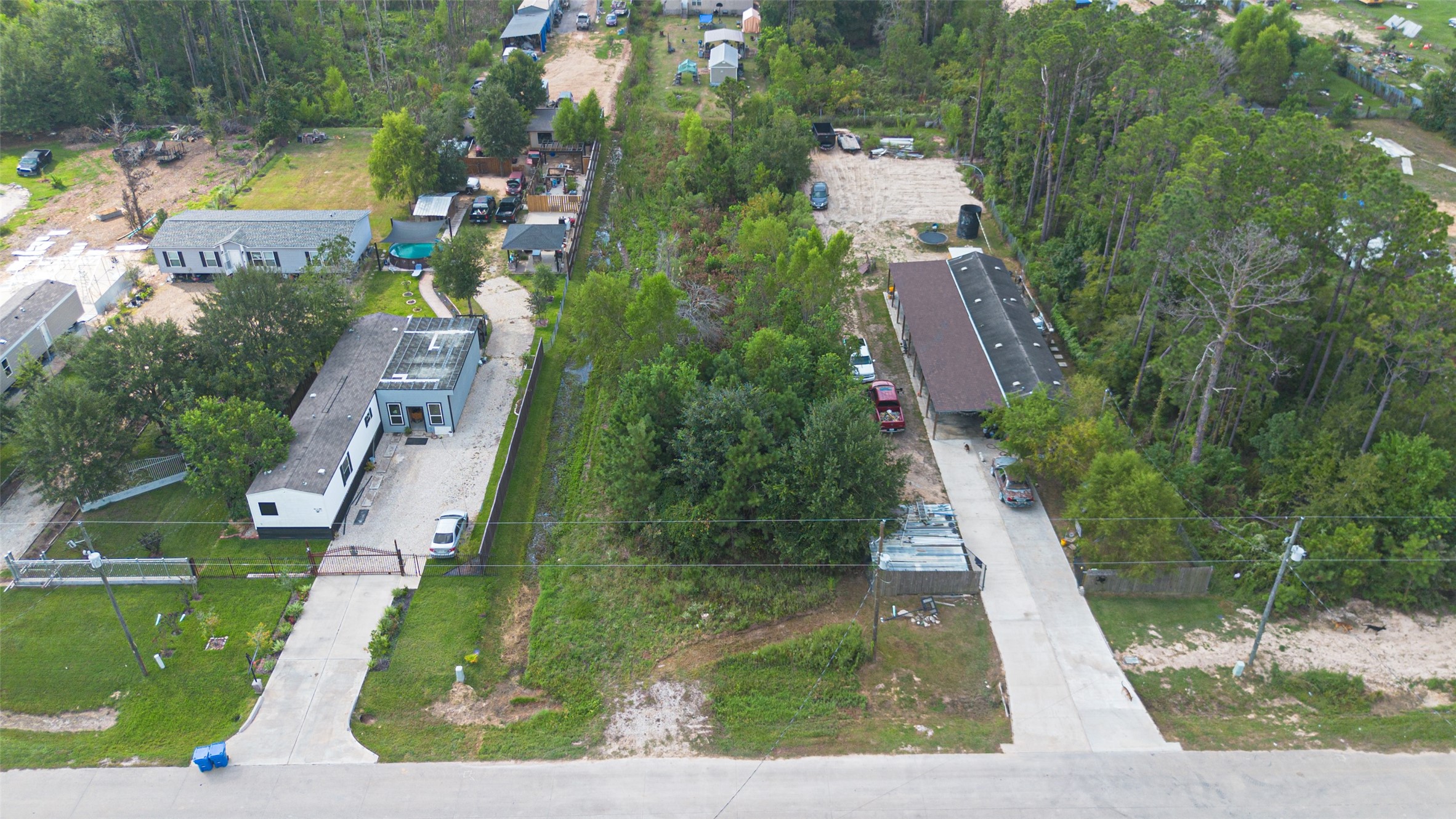 128 County Road 3548 Cleveland, TX 77327 - Photo 3 of 14 an aerial view of a house