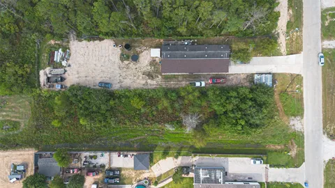 an aerial view of residential house with outdoor space