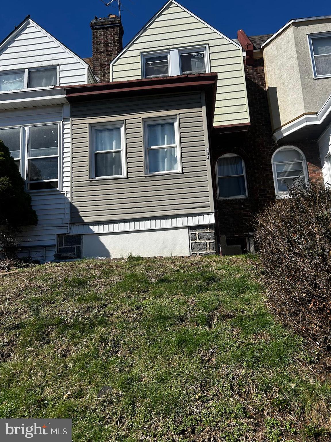 504 Woodcliffe Road Upper Darby, PA 19082 - Photo 1 of 8 a front view of a house with a yard