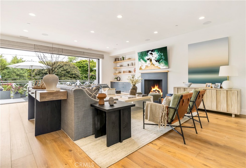 625 St James Road Newport Beach, CA 92663 - Photo 13 of 47 a living room with a couch and a fireplace