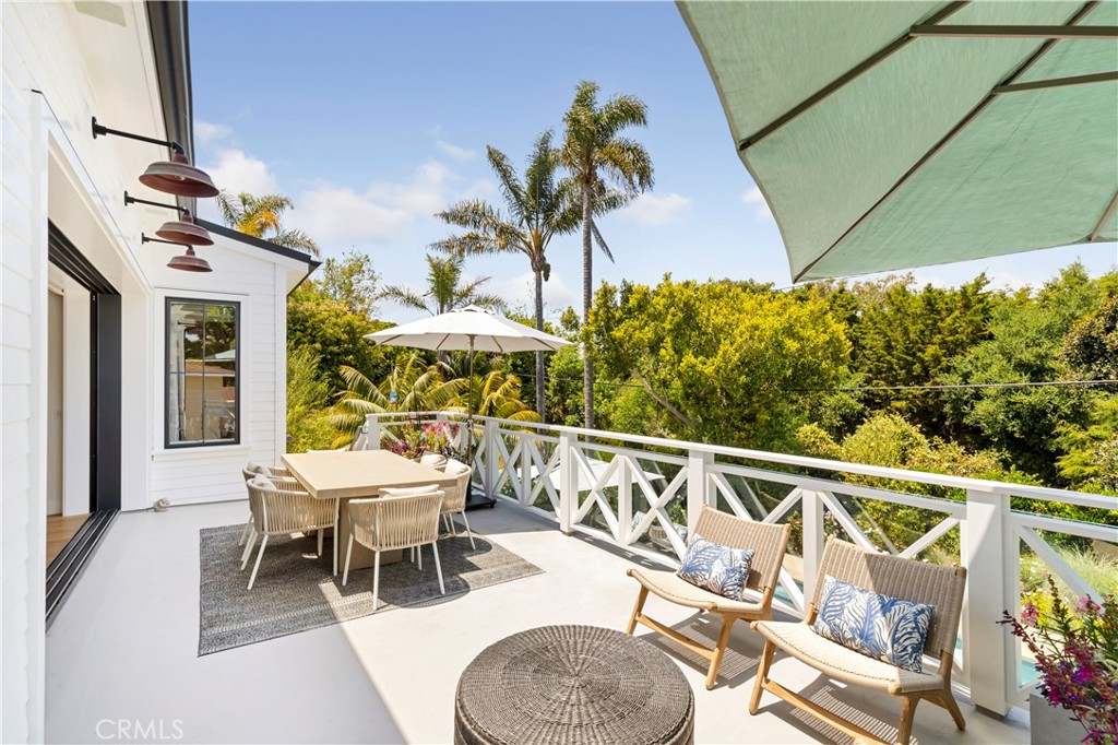 625 St James Road Newport Beach, CA 92663 - Photo 15 of 47 a balcony with table and chairs