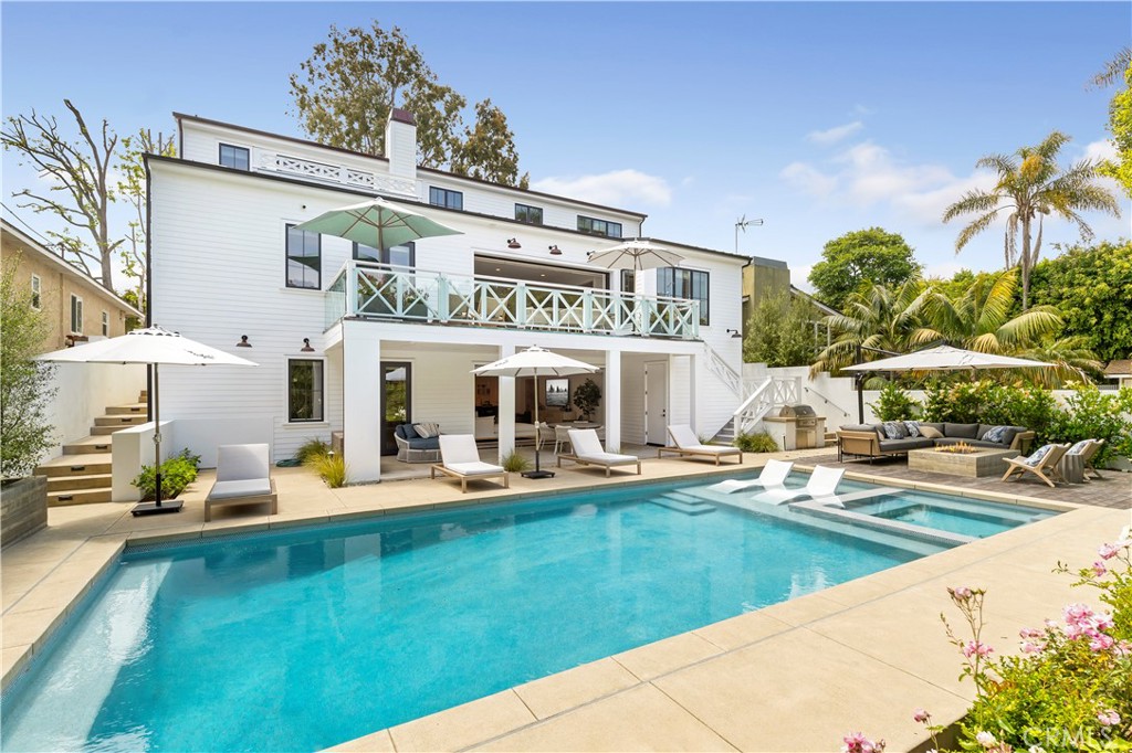 625 St James Road Newport Beach, CA 92663 - Photo 18 of 47 a view of a house with pool and sitting area