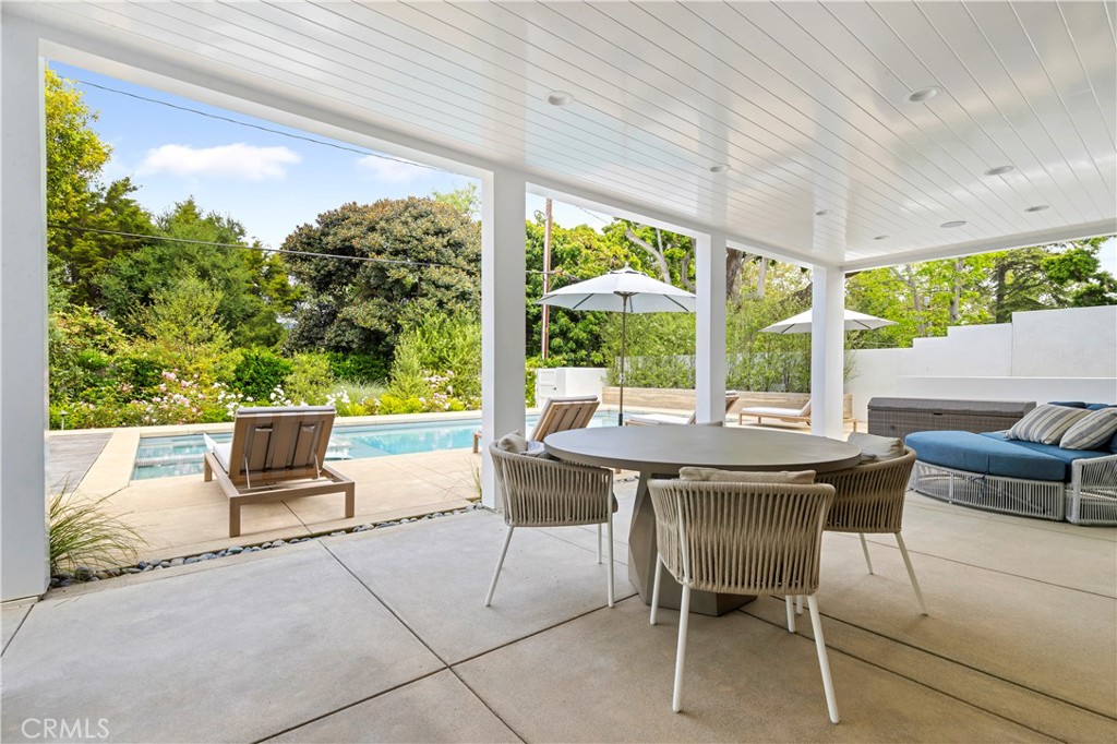 625 St James Road Newport Beach, CA 92663 - Photo 23 of 47 a patio with a table and chairs